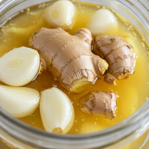 Mix together the grated ginger, onion, garlic, lemon juice and honey. Here’s how to make it